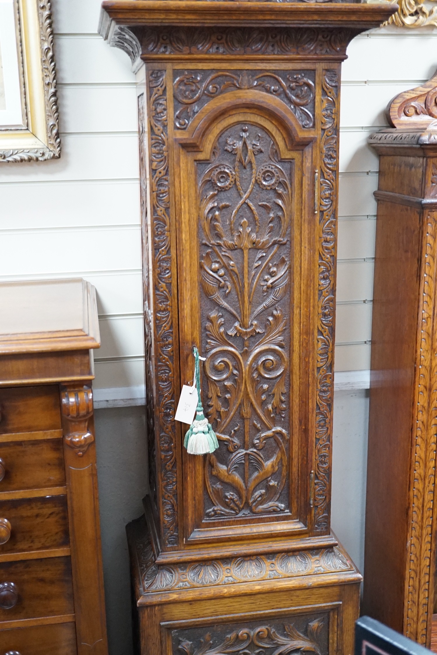 A late Victorian Camerer Cuss & Co carved oak chiming longcase clock, height 237cm *Please note the sale commences at 9am.